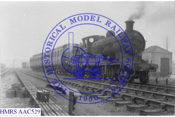 [AAC529] 4-4-0 LNE xNBR D32 9886 heading split passenger train. Rear attached coach derailed, remainder of tr