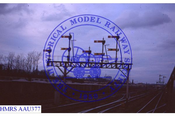 [AAU377] Westbury. Up signal gantry south of station.
