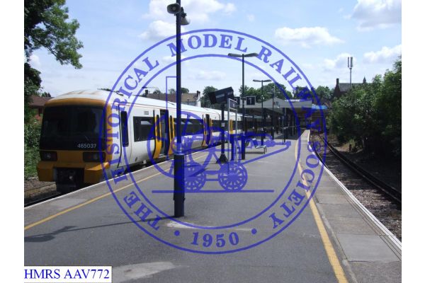 [AAV772] Standing about mid way along platforms looking south west, west towards the station building.  46503
