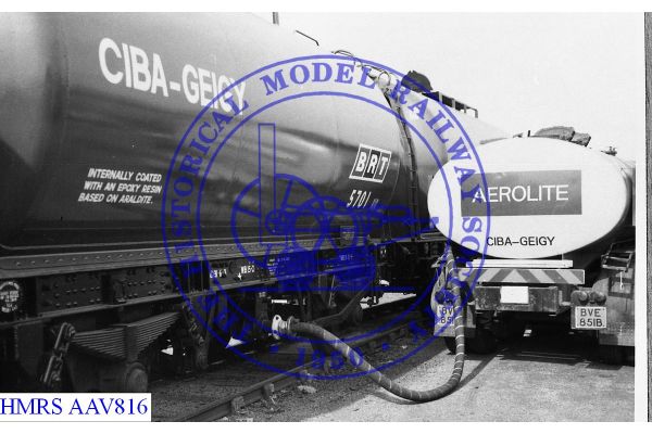 [AAV816] Ciba-Geigy/BRT (UK) Ltd tank wagon No 5701 being unloaded with pipe to road tank wagon alongside. Bl