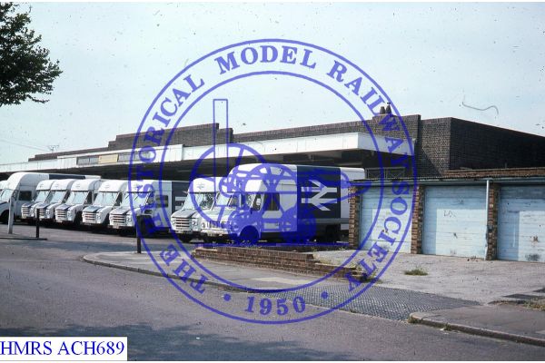 [ACH689] Row of several parcels road vans parked outside Southend East F3L Sited on Up side of line, part bui