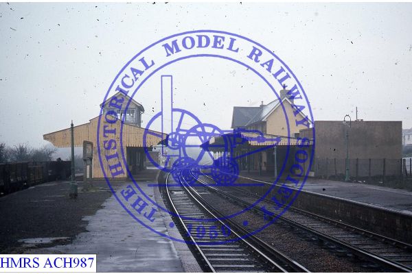 [ACH987] Sandown, General view NE from Sth end of Up platform, various buildings. Signal box sprouts from cen