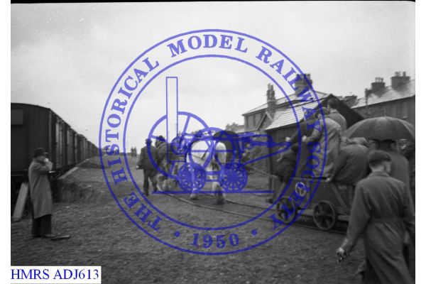 [ADJ613] Horse tramway with horse hauled train approaching interchange loading bank with BR