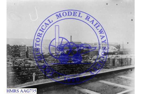 [AAG735] Pig iron storage yard, Crane Tank, LNWR coaches background. Part Chester Lines all steel (sleepers,