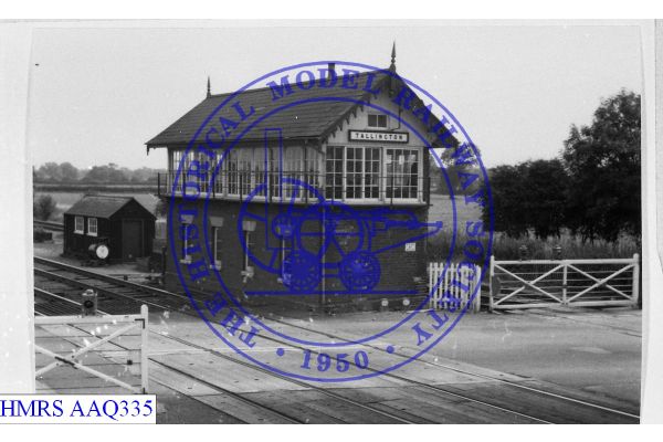 [AAQ335] Signal box, NE corner, unusual level crossing gates.