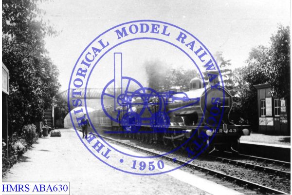 [ABA630] 4-6-0 HR   143 unidLoc F3R double heading a 4-4-0 passenger train arriving at station, possibly Blai