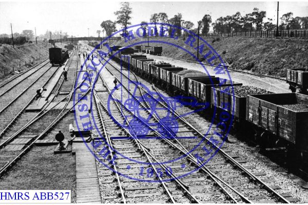 [ABB527] Kelvedon goods yard, trackwork & ftbrdge 1911 s/west towards London from signal box. Goods and coal