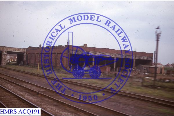 [ACQ191] Connahs Quay Engine Shed (disused) on Down side of line seen from Up Train